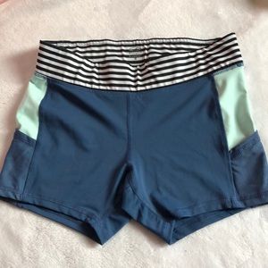 Blue/ teal spandex shorts.